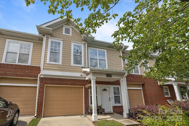 15432 Coventry Court Ln, Charlotte, NC 28277 - view of property with brick siding, an attached garage, and driveway