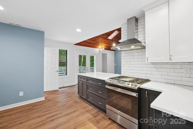8338 Rittenhouse Cir, Charlotte, NC 28270 - kitchen featuring stainless steel gas range oven, wall chimney exhaust hood, white cabinets, light countertops, and recessed lighting