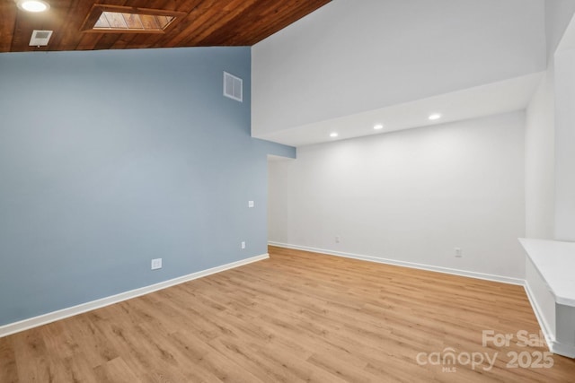 8338 Rittenhouse Cir, Charlotte, NC 28270 - empty room with a skylight, recessed lighting, light wood-type flooring, wood ceiling, and baseboards