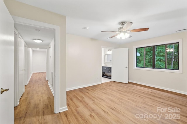 8338 Rittenhouse Cir, Charlotte, NC 28270 - spare room featuring light wood finished floors, baseboards, and a ceiling fan