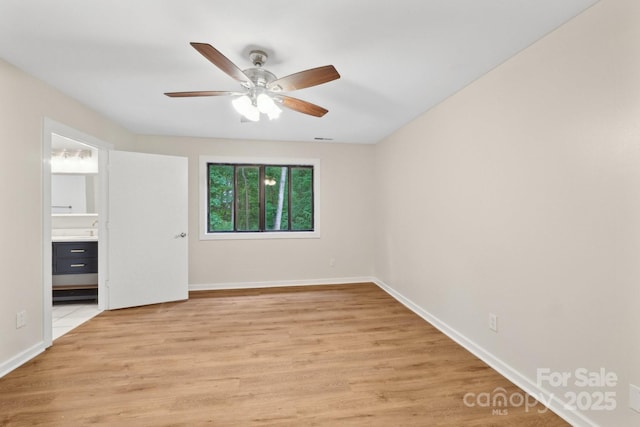 8338 Rittenhouse Cir, Charlotte, NC 28270 - unfurnished room featuring a ceiling fan, light wood finished floors, and baseboards