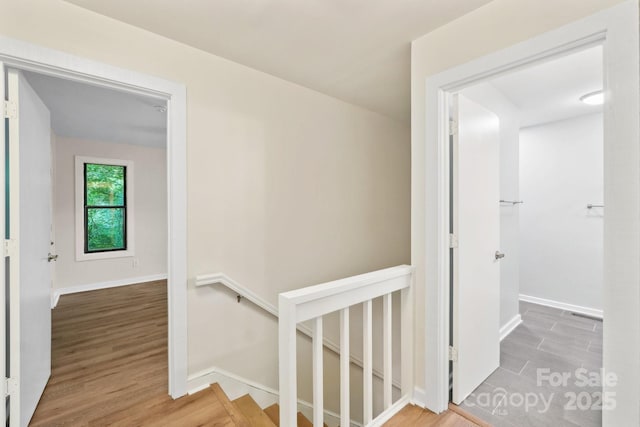 8338 Rittenhouse Cir, Charlotte, NC 28270 - corridor featuring an upstairs landing, wood finished floors, and baseboards