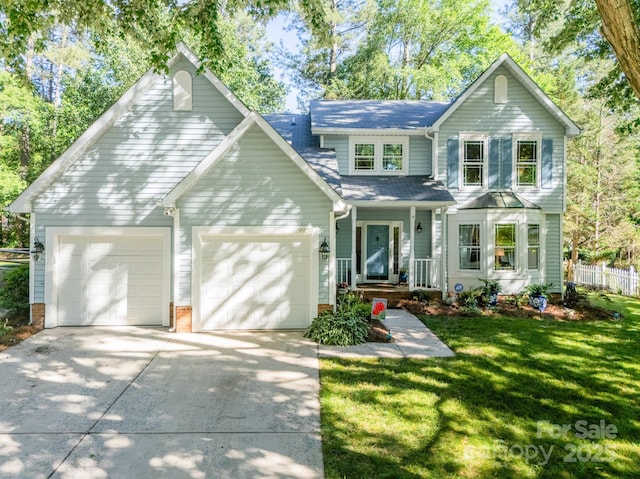 9920 White Cascade Dr, Charlotte, NC 28269 - traditional-style home with an attached garage, concrete driveway, a shingled roof, and a porch