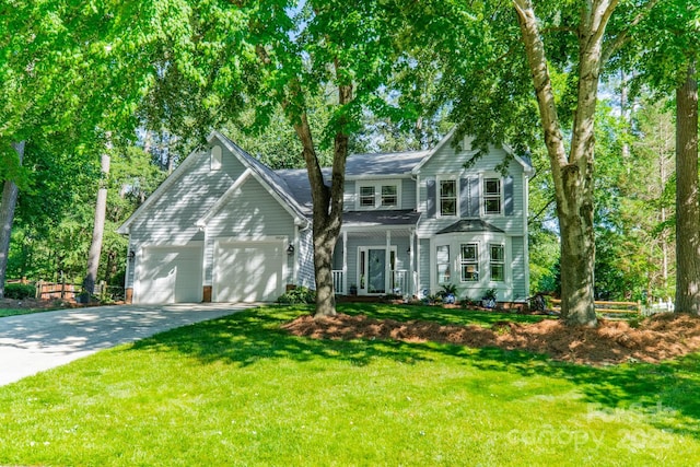 9920 White Cascade Dr, Charlotte, NC 28269 - traditional-style house with an attached garage, driveway, and a front lawn