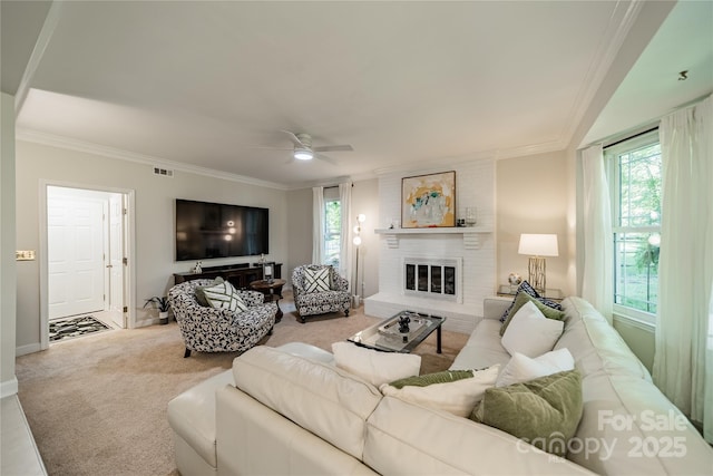 9920 White Cascade Dr, Charlotte, NC 28269 - carpeted living room featuring crown molding, healthy amount of natural light, ceiling fan, a brick fireplace, and baseboards