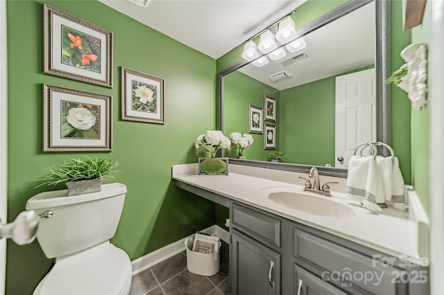 9920 White Cascade Dr, Charlotte, NC 28269 - half bathroom featuring vanity, toilet, and baseboards
