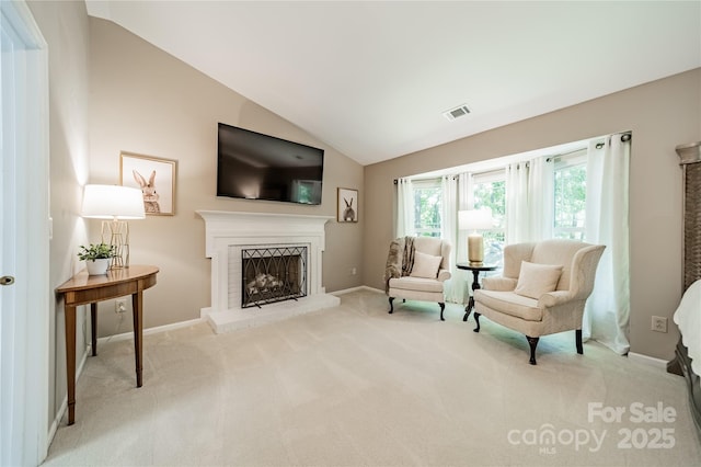 9920 White Cascade Dr, Charlotte, NC 28269 - living area featuring carpet floors, a brick fireplace, lofted ceiling, and baseboards