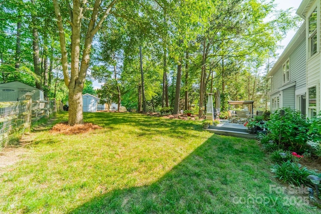 9920 White Cascade Dr, Charlotte, NC 28269 - view of yard with a deck