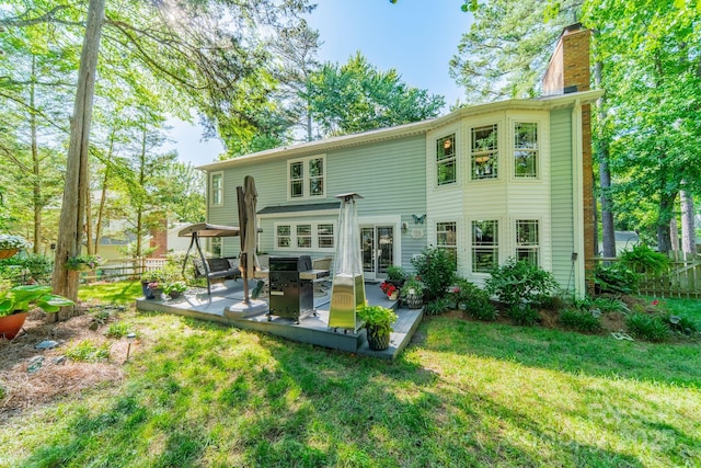9920 White Cascade Dr, Charlotte, NC 28269 - rear view of house with a chimney and a patio