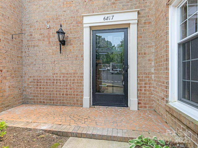 6817 Dumbarton Dr, Charlotte, NC 28210 - doorway to property with brick siding