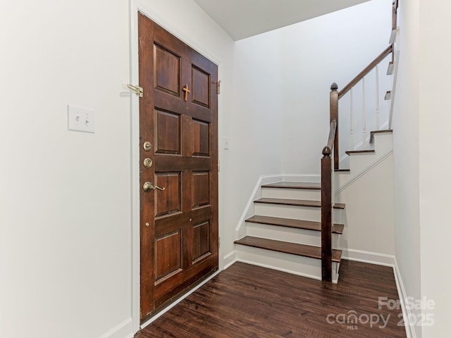 6817 Dumbarton Dr, Charlotte, NC 28210 - entryway featuring dark wood-style flooring, stairway, and baseboards