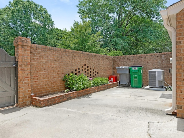 6817 Dumbarton Dr, Charlotte, NC 28210 - fenced backyard with a patio, cooling unit, and a gate