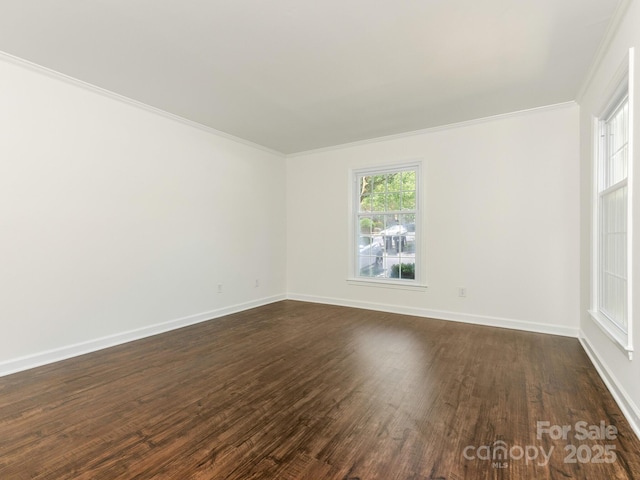 6817 Dumbarton Dr, Charlotte, NC 28210 - empty room featuring crown molding, dark wood finished floors, and baseboards