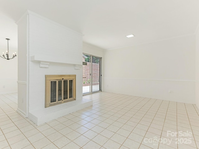 6817 Dumbarton Dr, Charlotte, NC 28210 - unfurnished living room featuring ornamental molding, light tile patterned flooring, a brick fireplace, and a chandelier