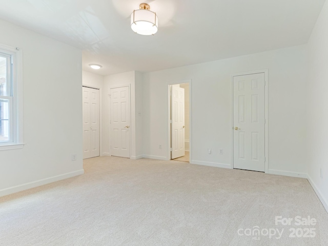 6817 Dumbarton Dr, Charlotte, NC 28210 - unfurnished bedroom featuring carpet flooring, baseboards, and connected bathroom