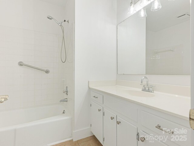 6817 Dumbarton Dr, Charlotte, NC 28210 - full bathroom featuring vanity, shower / bathtub combination, tile patterned floors, and baseboards