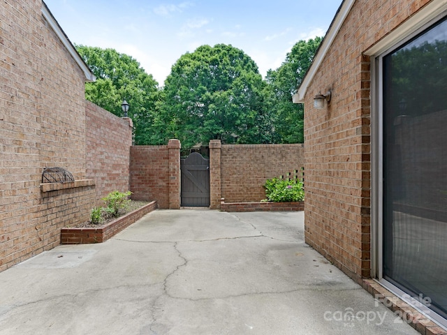 6817 Dumbarton Dr, Charlotte, NC 28210 - view of patio / terrace featuring a gate