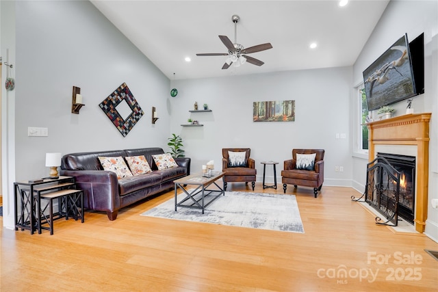 21 Kylie Grace Ln, Candler, NC 28715 - living room featuring light wood finished floors, ceiling fan, a lit fireplace, recessed lighting, and baseboards