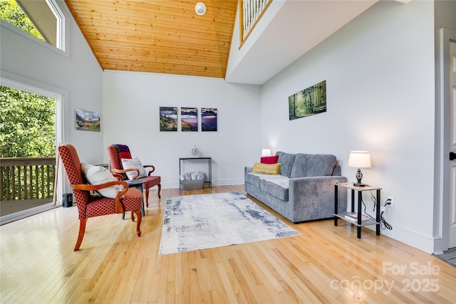 21 Kylie Grace Ln, Candler, NC 28715 - living room with high vaulted ceiling, wood finished floors, baseboards, and wood ceiling