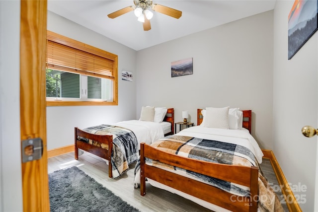 21 Kylie Grace Ln, Candler, NC 28715 - bedroom featuring baseboards, wood finished floors, and a ceiling fan