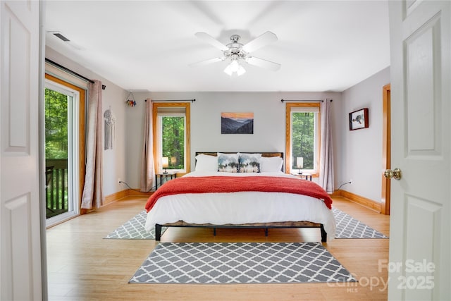 21 Kylie Grace Ln, Candler, NC 28715 - bedroom with multiple windows, access to outside, and baseboards