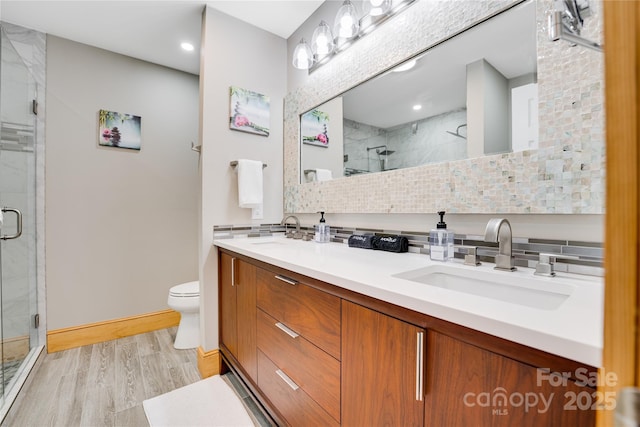 21 Kylie Grace Ln, Candler, NC 28715 - full bathroom with double vanity, a shower stall, and tasteful backsplash