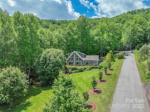21 Kylie Grace Ln, Candler, NC 28715 - aerial view of property and surrounding area featuring a heavily wooded area