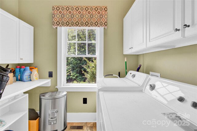 267 Ikerd Dr SE, Concord, NC 28025 - laundry room featuring washing machine and clothes dryer and cabinet space