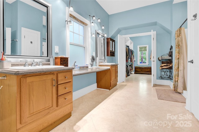 267 Ikerd Dr SE, Concord, NC 28025 - full bathroom featuring vanity and a walk in closet