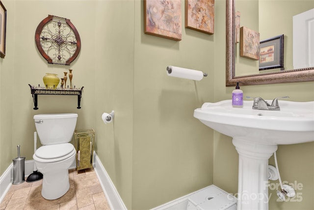 267 Ikerd Dr SE, Concord, NC 28025 - bathroom with toilet and stone finish flooring