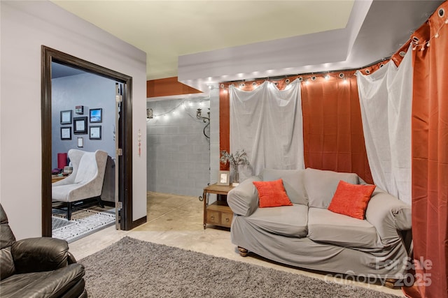 267 Ikerd Dr SE, Concord, NC 28025 - living room featuring concrete floors and concrete block wall