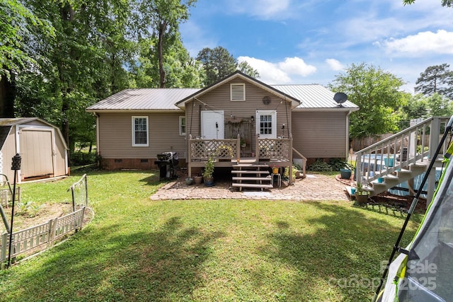 716 Mooresville Rd, Salisbury, NC 28144 - back of house featuring stairway, a deck, metal roof, crawl space, and a patio