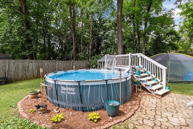 716 Mooresville Rd, Salisbury, NC 28144 - view of pool with stairway, a deck, and view of wooded area