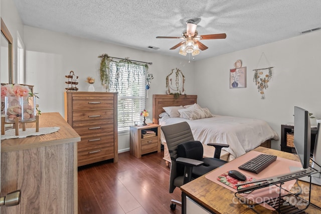 716 Mooresville Rd, Salisbury, NC 28144 - bedroom featuring dark wood-style flooring, an office area, a textured ceiling, and a ceiling fan