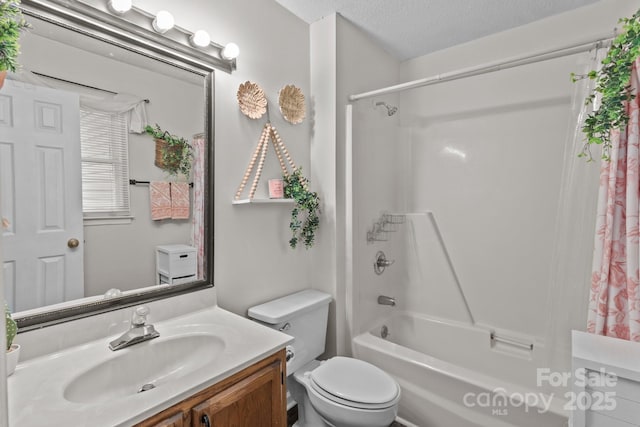 716 Mooresville Rd, Salisbury, NC 28144 - bathroom featuring shower / bath combination with curtain, vanity, toilet, and a textured ceiling