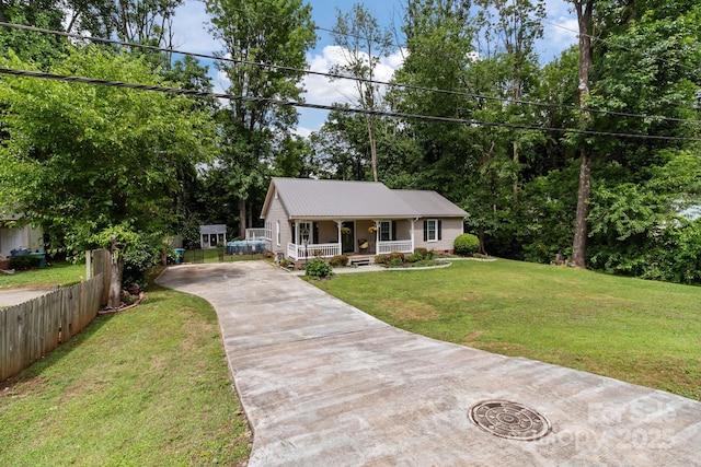 716 Mooresville Rd, Salisbury, NC 28144 - view of front of house with a porch, driveway, and metal roof