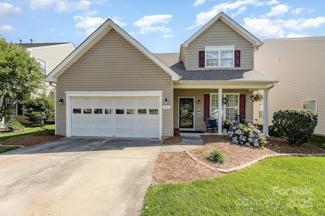 411 Summergate Dr Unit 78, Winston Salem, NC 27103 - view of front of house featuring covered porch, driveway, an attached garage, and roof with shingles