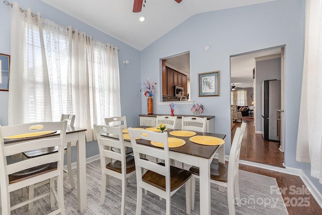411 Summergate Dr Unit 78, Winston Salem, NC 27103 - dining area featuring ceiling fan, vaulted ceiling, wood finished floors, and baseboards