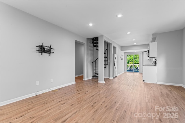 146 Georgia St SW, Concord, NC 28025 - unfurnished living room featuring light wood-type flooring, recessed lighting, and stairway