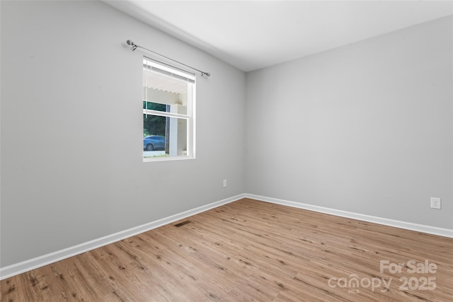 146 Georgia St SW, Concord, NC 28025 - spare room featuring wood finished floors and baseboards