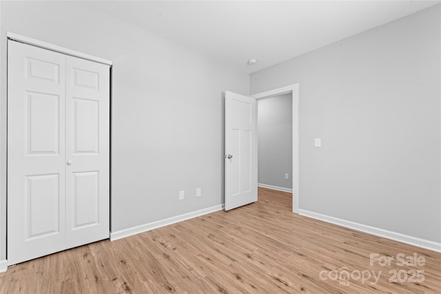 146 Georgia St SW, Concord, NC 28025 - unfurnished bedroom featuring light wood finished floors and a closet