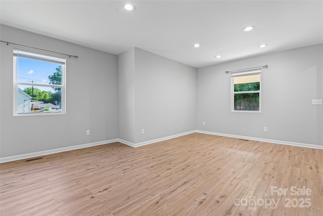 146 Georgia St SW, Concord, NC 28025 - empty room featuring light wood-style floors and recessed lighting