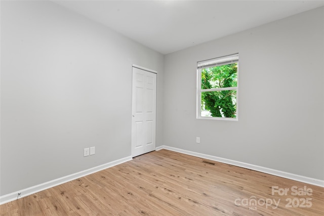 146 Georgia St SW, Concord, NC 28025 - spare room with wood finished floors and baseboards