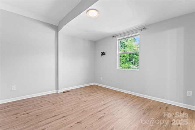 146 Georgia St SW, Concord, NC 28025 - spare room with wood finished floors and baseboards