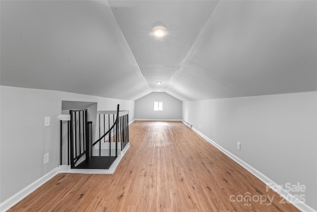 146 Georgia St SW, Concord, NC 28025 - additional living space with lofted ceiling and wood-type flooring