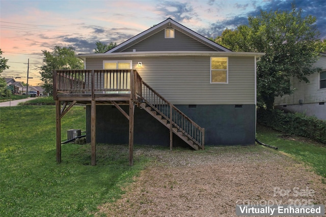 146 Georgia St SW, Concord, NC 28025 - back of property at dusk featuring crawl space, a yard, stairs, and a deck