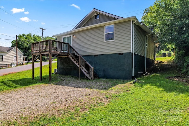 146 Georgia St SW, Concord, NC 28025 - rear view of house with a deck, stairs, a lawn, and crawl space