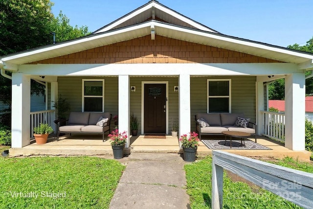 146 Georgia St SW, Concord, NC 28025 - bungalow-style house with an outdoor hangout area and a porch