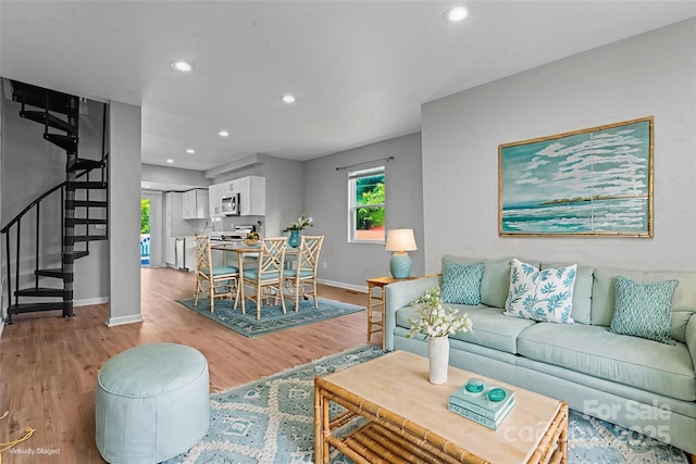 146 Georgia St SW, Concord, NC 28025 - living area featuring stairs, light wood-type flooring, and recessed lighting