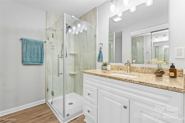 146 Georgia St SW, Concord, NC 28025 - full bathroom featuring a shower stall, vanity, and wood finished floors